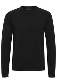 Zwarte lange mouwen crewneck trui met een gestructureerd patroon en geribbelde boorden. Heeft raglanmouwen en een klein logolabel aan de onderzijde.
