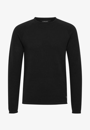 Mustavalkea pitkähihainen crewneck-paitapusero, jossa on teksturoitu kuvio ja resorit hihansuissa. Sisältää raglan-hihat ja pienen logotunnisteen helmassaan.