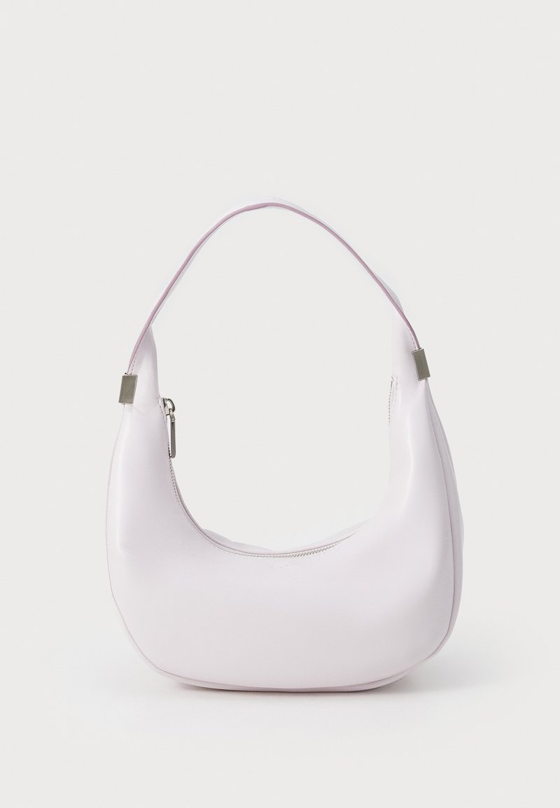 A curved, soft pink handbag made of smooth faux leather, featuring a single handle and a zippered compartment with metallic accents.