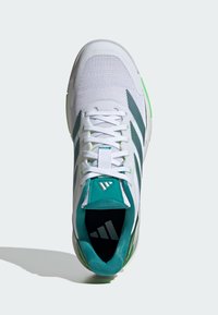 White athletic shoe with mesh upper, teal accents, and three black stripes on the side. Features a cushioned sole and looped tongue.