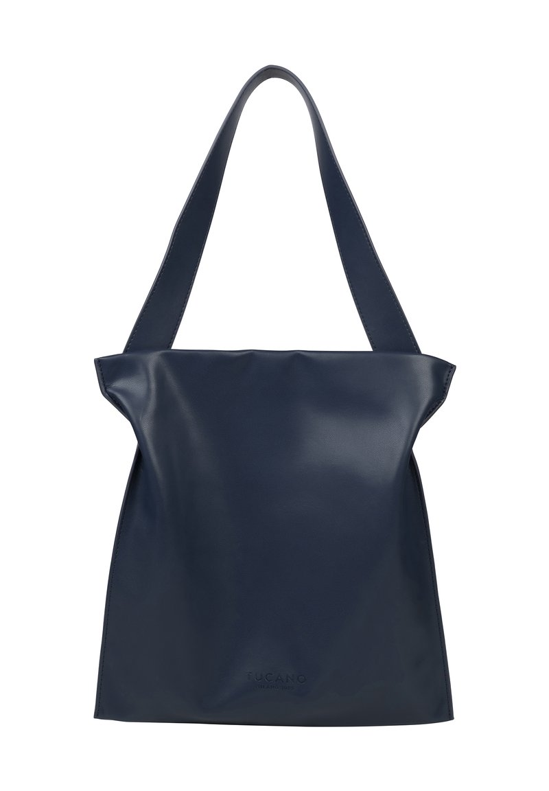 Navy blue leather tote bag with a minimalist design, featuring a slouchy shape and dual flat handles. Subtle branding at the base.