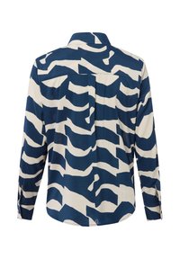 Button-up shirt in navy and cream with wavy abstract pattern, long sleeves, collar, and rounded hem, made of lightweight fabric.