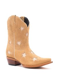 Stivale cowboy in suede beige con ritagli a forma di stella, punta affusolata e tacchi a blocco. Le cuciture e i lati accentuati offrono un design western classico.