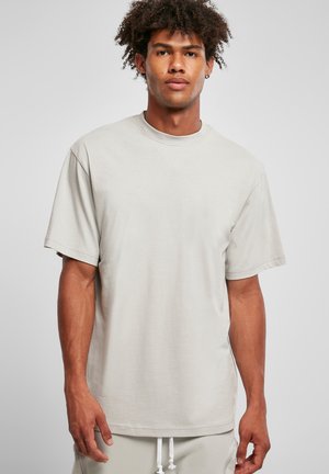 Light gray short-sleeve T-shirt with a crew neckline, made from soft cotton fabric, featuring a relaxed fit and minimal design.
