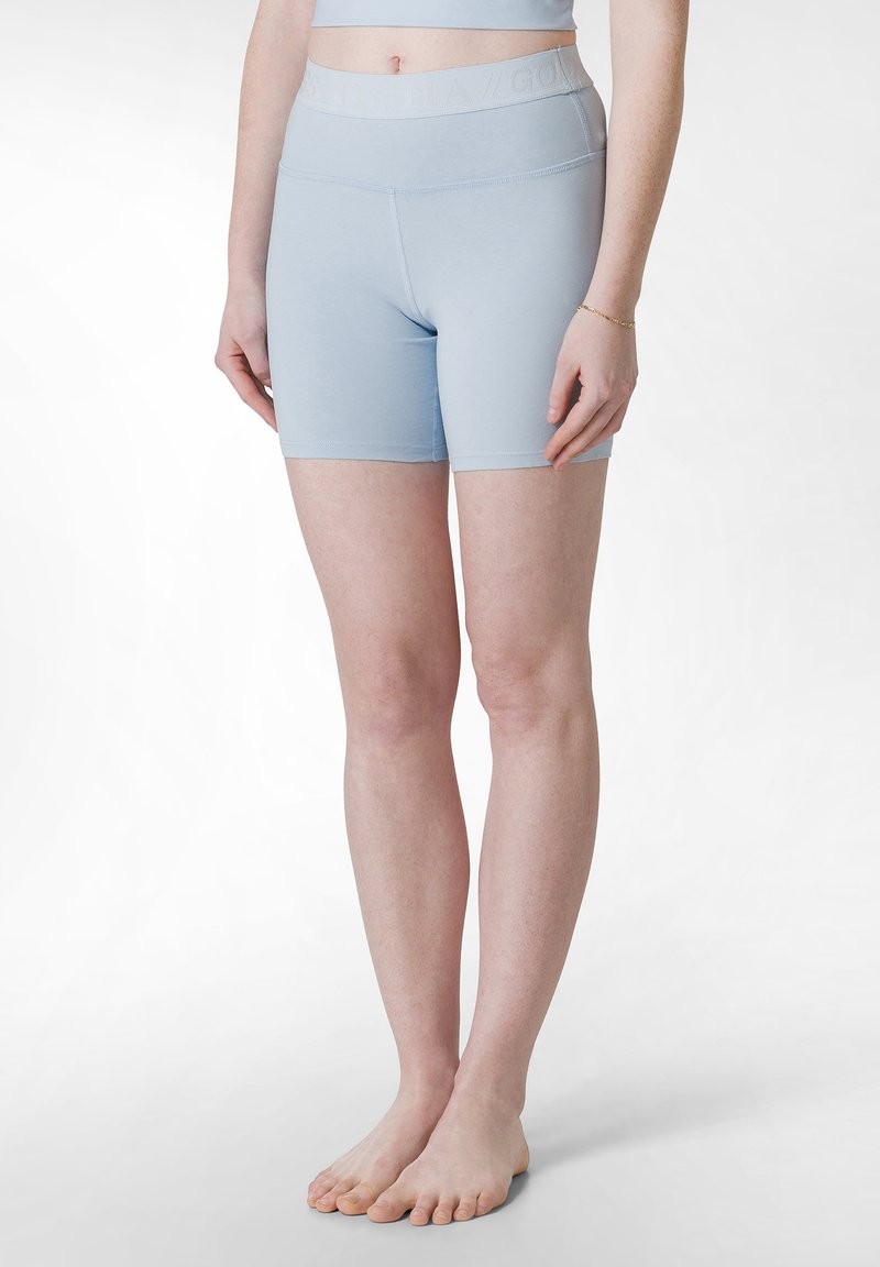 Ljusblå atletikshorts tillverkade av stretchmaterial. Hög midja, figurnära design, slät textur, lämpliga för träning.