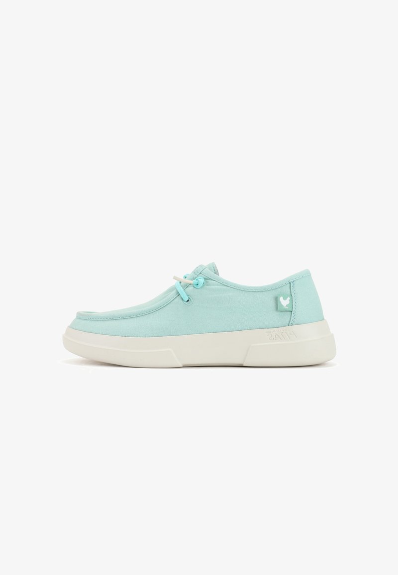 Light blue canvas shoe with a rounded toe, white rubber sole, flat laces, and small logo accent on the heel.