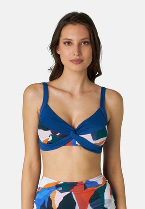 Top di bikini blu con design frontale annodato. Il tessuto presenta un motivo astratto colorato con forme e tonalità variabili.