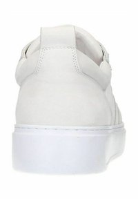 White sneaker with a smooth leather upper, minimalist design, and a thick white rubber sole. Features a stitched seam and padded heel.