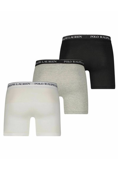 Trei perechi de boxeri scurți în alb, gri și negru. Realizați dintr-un material moale, având brâuri elastice cu logo-ul „POLO RALPH LAUREN”.