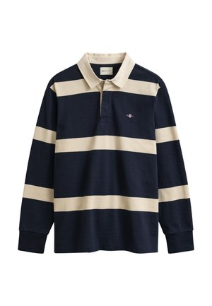 Laivastonsininen pitkähihaisen rugby-paita, jossa leveät beiget vaakaraitaiset kuviot ja beige kaulus, jossa pieni rintalogo.