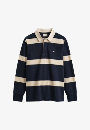 Laivastonsininen pitkähihaisen rugby-paita, jossa leveät beiget vaakaraitaiset kuviot ja beige kaulus, jossa pieni rintalogo.