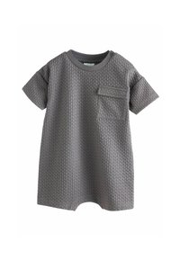 Kurzärmliger Jumpsuit aus strukturiertem grauem Baumwollstoff, mit Rundhalsausschnitt, Brusttasche und abgerundetem Saum für erhöhte Bewegungsfreiheit.