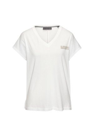 Camiseta blanca de algodón con cuello en V, mangas cortas y un corte relajado. Presenta un sutil estampado en un color marrón claro en la parte delantera.