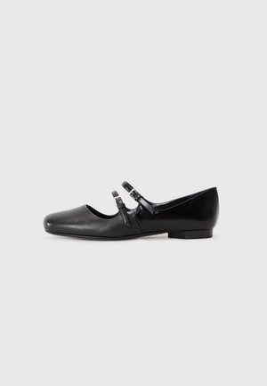 Black leather flat shoe with a squared toe, featuring two buckle straps across the instep and a low, block heel. Smooth texture.