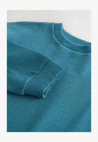 No seleccionado, teal blue