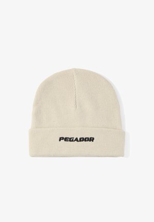 Bonnet en tricot côtelé de couleur crème avec bord plié et texte brodé noir "PEGADOR" au centre devant.