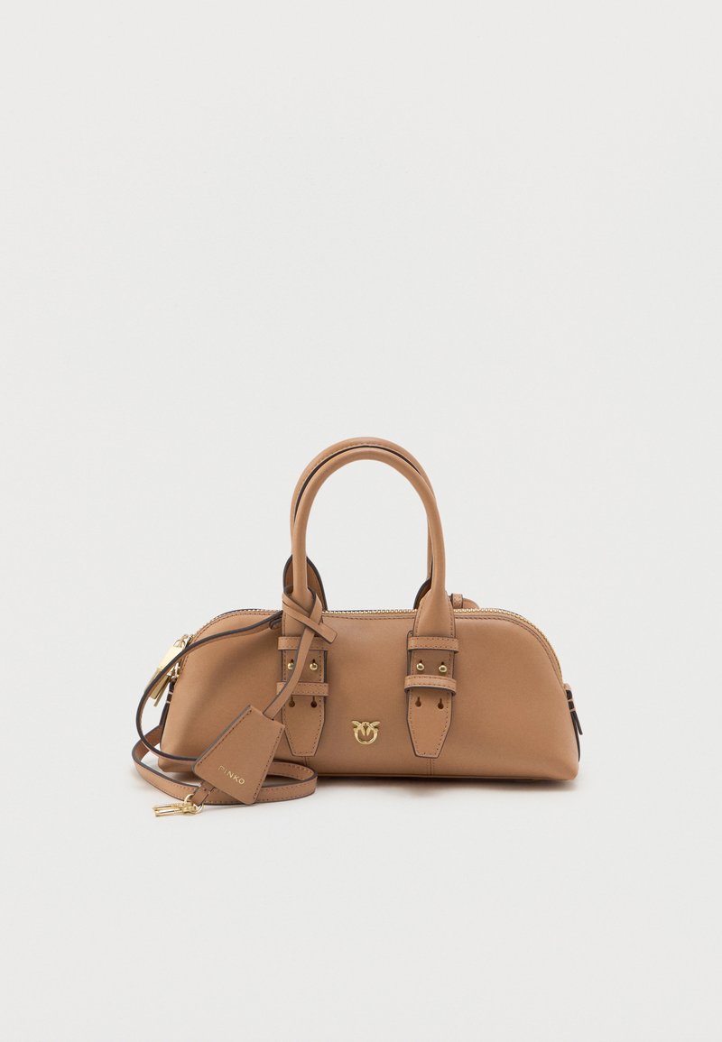 Tan leather handbag with a rounded shape, gold hardware accents, dual top handles, and a detachable shoulder strap. Features a logo detail.