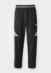 Black Adidas basketball pants with white stripes on thighs and an elastic waistband with black and white pattern.