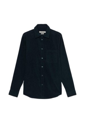 Camicia in corda di un blu navy scuro con colletto abbottonato, maniche lunghe, tasca sul petto e bottoni azzurri chiari. Tessuto testurizzato e orlo dritto.