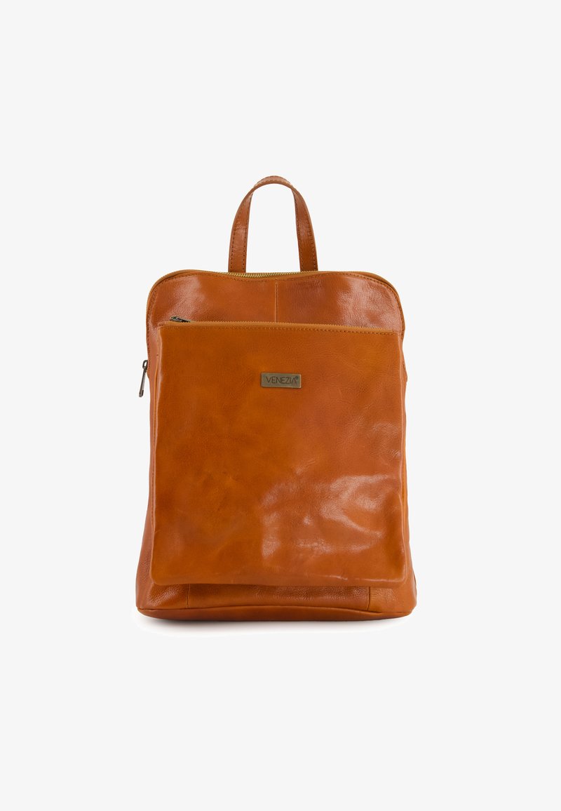 Brown leather backpack with a smooth texture, top handle, and a front zip pocket. Features a subtle logo plate and minimalist design.
