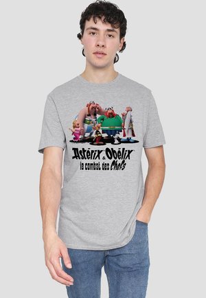 Gray cotton t-shirt featuring Asterix and Obelix characters, with "Asterix & Obelix le combat des Chefs" printed in black below the graphic.
