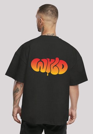 Black oversized t-shirt featuring a colorful "WYKD" graphic in orange to yellow gradient on the back. Short sleeves, cotton material.
