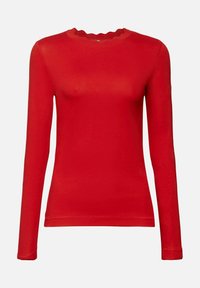 Red long-sleeve top made of soft fabric, features a scalloped neckline, and a fitted silhouette. No patterns or accents are visible.