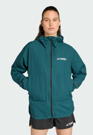 Veste imperméable teal avec capuche et fermeture éclair. Comprend deux poches avant et le logo "TERREX" sur la poitrine. Conception légère.