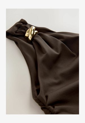Dark brown swimsuit featuring a gathered fabric design with a twisted accent and gold-tone metal hardware detail. Smooth texture.