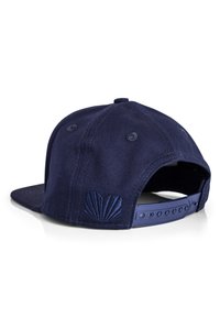 Navy blue cap with a structured shape, fabric texture, and embroidered shell logo on the back. Features an adjustable plastic strap.