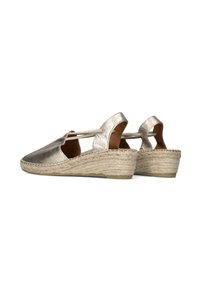 Metallic silver espadrille slingbacks with an open back, woven jute wedge heel, and a smooth, textured upper material.