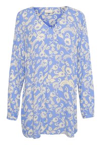 Blouse à manches longues bleu à col en V, ornée d'un motif de fleurs et de feuilles blanches, avec une texture douce et une coupe décontractée.