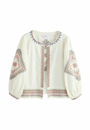 Krämfärgad blus med långa ärmar och blommig broderi i röd, blå och grön. Har rund halslinning och knäppning framtill.