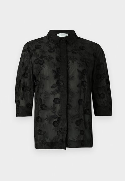 Black shirt with floral embroidery, long sleeves, and a collared neck. Sheer fabric with a textured finish and intricate detailing.