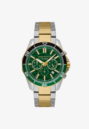 Orologio con quadrante verde e cinturino in metallo dorato e argentato. Caratterizzato da una lunetta nera, sottoquadranti verdi texturizzati e una visualizzazione della data in posizione 4.