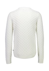 Romantische trui met een getextureerd diamantpatroon, ronde hals, en ribbelboorden en -zoom. De stof lijkt zacht en chunky.