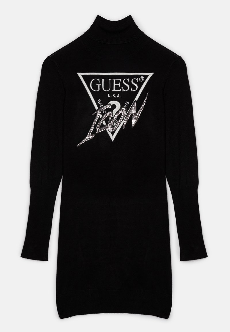 Robe noire à col roulé manches longues avec logo triangulaire blanc Guess USA et le mot "ICON" orné de strass sur le devant.