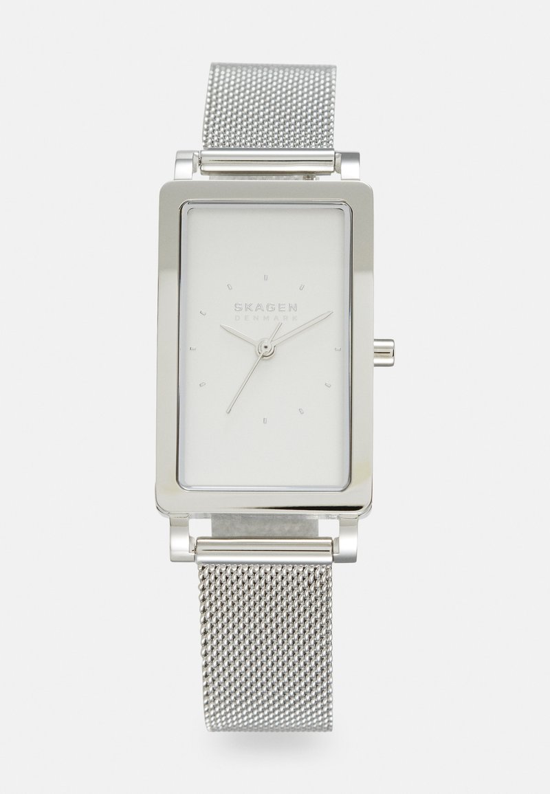 Silver rectangular watch with a white dial, minimalist hour markers, and silver mesh band. Features a push-pull crown and metallic finish.