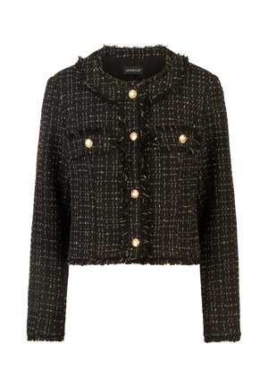Zwarte cropped jack van gestructureerde stof met gouden draad, met een knoopsluiting, cropped ontwerp en rafelige randen. Vier voorzakken.