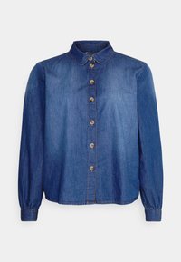 Blå denimskjorta med krage, långa puffärmar och knappstängning fram. Har en slät textur och subtila sömnadsdetaljer.