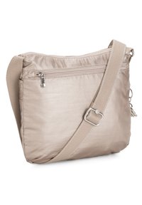 Beige crossbody bag made of soft, textured nylon, featuring a zippered pocket and an adjustable strap. Simple design with minimal hardware.