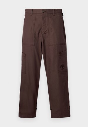 Brown cargo pants made from durable fabric. Features two side pockets, a button closure, and logo embroidery on the leg.