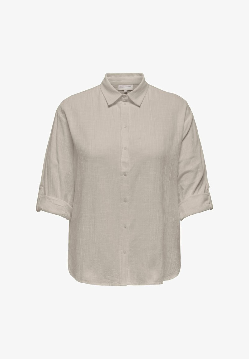 Svetlo bež srajca s gumbi, zavihanimi rokavi in teksturirano tkanino, z klasičnim ovratnikom in ravnim robom.