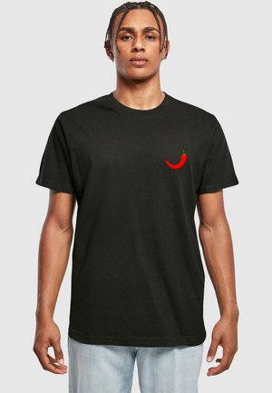 Black cotton t-shirt featuring a red chili pepper embroidered on the left chest, round neck, and short sleeves.