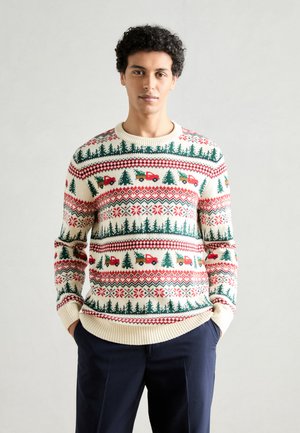Knit sweater featuring a cream base with red and green patterns, including trees and trucks. Ribbed cuffs and hem. Classic crew neck design.
