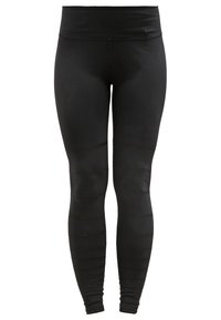 Černé sportovní legíny vyrobené z elastického materiálu, s vysokým pasem a žebrovanou texturou na dolních nohavicích. Diskrétní detail loga Nike.