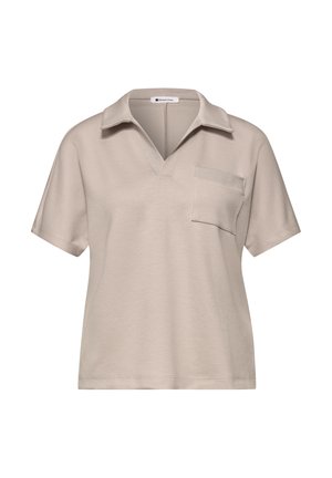 Beigen värinen lyhythihainen poolopaita lovikauluksella ja vasemmalla rinnassa olevalla taskulla, pehmeää kangasta.