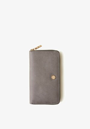 Gray leather zip-around wallet with gold zipper and round gold button detail, shown closed on a white background.