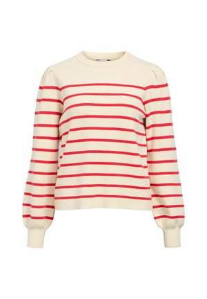 Kreminės spalvos megztinis su horizontaliomis raudonomis juostelėmis, apvalia iškirpte ir pūstomis rankovėmis. Pagamintas iš minkštos medžiagos su ribinėmis rankogaliais.