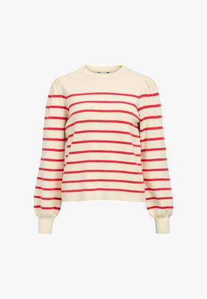 Kreminės spalvos megztinis su horizontaliomis raudonomis juostelėmis, apvalia iškirpte ir pūstomis rankovėmis. Pagamintas iš minkštos medžiagos su ribinėmis rankogaliais.